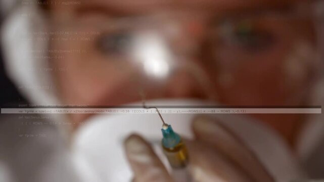 Nurse checking medical syringe with amber liquid, priming, tapping, forcing drops with scan lines