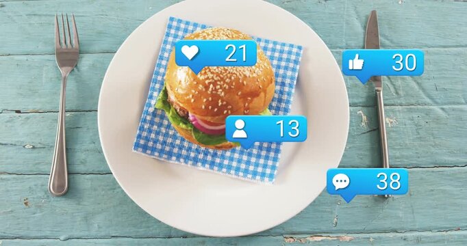 First blue bubble appearing, blue bubbles multiplying beside sesame burger, showing rising likes