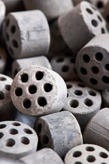 Carbon dioxide reforming of methane nickel catalyst seven holes cylinder pellet form shape methanol synthesis industrial petrochemical selective focus close up vertical shot texture background.