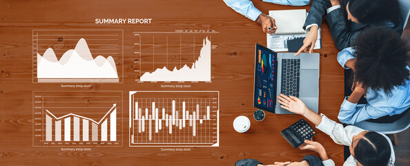 A business meeting in progress featuring diverse individuals analyzing charts and graphs displayed on laptops, emphasizing collaboration and data-driven decision-making. Axiom