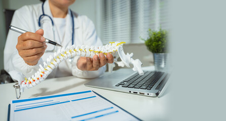 serious doctors are analyzing fracture knee model showing the process of osteoarthritis patients...