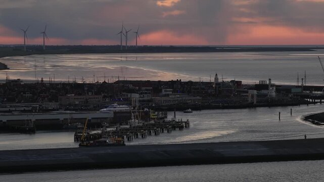 Offshore Workship Entering Harlingen Port at Dusk, Golden Hour Aerial View.