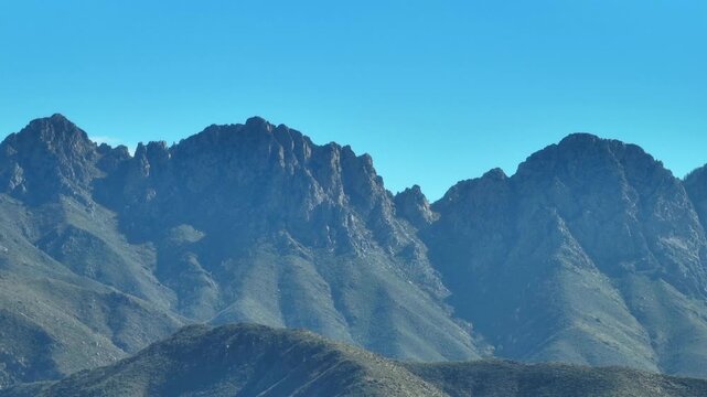 Aerial view of rugged Four Peaks Wilderness, where the majestic mountains rise against a clear sky, Apache Junction, Arizona, United States.