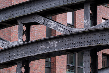 A detailed view of metal railings and elevated walkway elements revealing geometry, pattern and structure within modern urban architecture and exterior design contexts