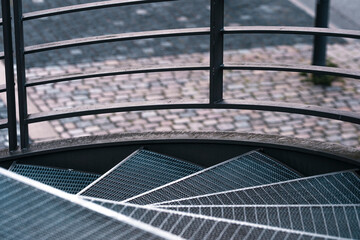 Patterned panels and geometric divisions reveal metal structure and detail, bringing modern exterior architecture and design into focus within an abstract urban setting