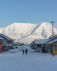 Couple Walking Longyearbyen Streets during Winter