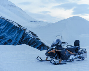 Snowmobile by Glacier Ice in Svalbard 