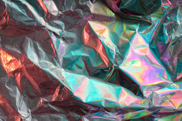 Iridescent foil texture, holographic surface, crumpled metallic, rainbow light shimmer