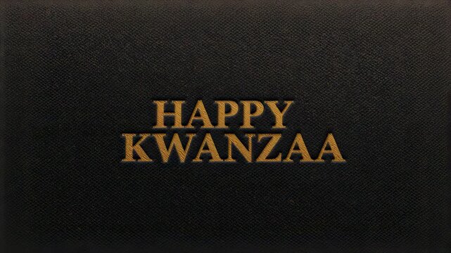 Shifting embossed gold HAPPY KWANZAA text with light skim revealing greeting on dark fabric