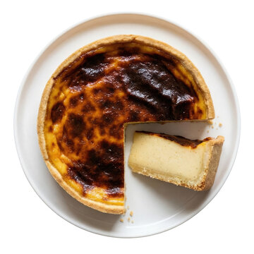 Delicious Flan Parisien custard tart, classic baked pastry dessert with slice cut out. Top view on plate
