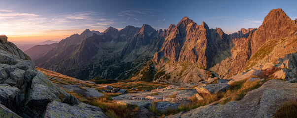 Golden sunrise mountain panorama rocky ridge landscape serene alpine dawn panorama