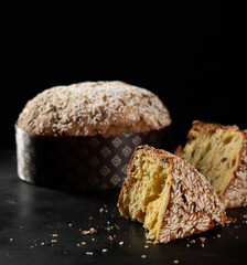 Panettone Traditional Italian cake for Christmas on rustic wooden table. Copy space