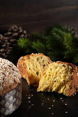 Panettone Traditional Italian cake for Christmas on rustic wooden table. Copy space