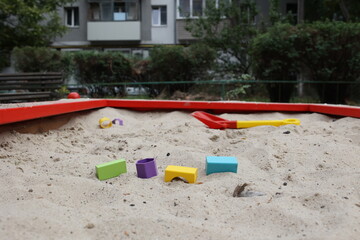 Sandbox with various outdoor toys. Sandbox for children's games. Summer concept.