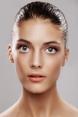 Fototapeta premium Portrait, skincare and woman in studio, makeup and beauty on white background. Glow, pride and person with cosmetics, confidence or foundation with wellness, healthy skin and aesthetic with collagen