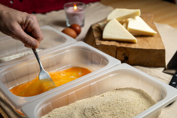 Bread the cheese with eggs and breadcrumbs