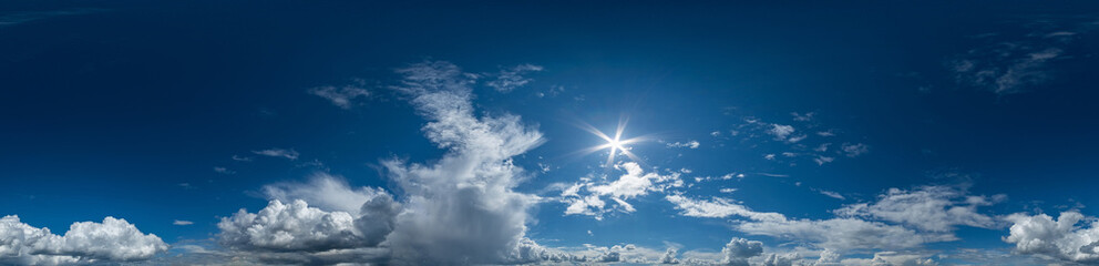 Seamless hdri panorama 360 degrees angle view blue sky with beautiful cumulus clouds with zenith for use in 3d graphics or game development as sky dome or edit drone shot