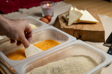 Bread the cheese with eggs and breadcrumbs