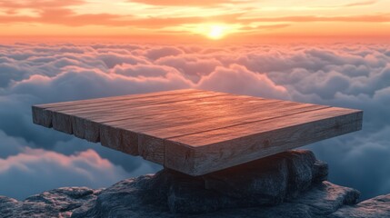 Wooden platform on clifftop above clouds at sunset