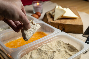 Bread the cheese with eggs and breadcrumbs