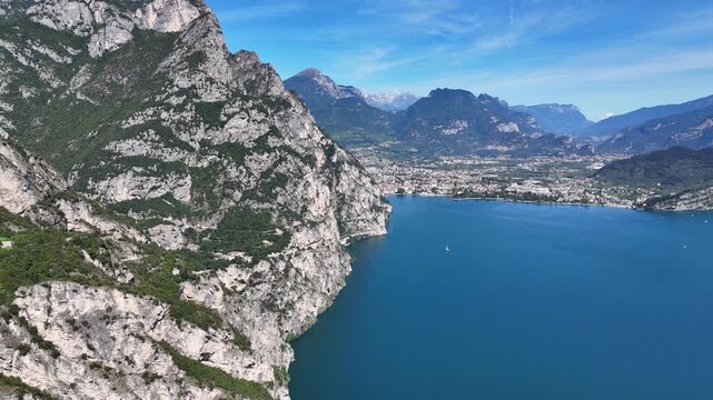 Drone shot of mountains surrounding riva del garda in Italy