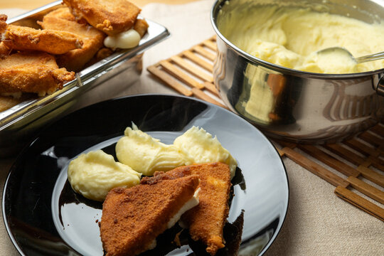 Cheese in breadcrumbs with smashed potato