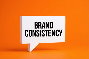 Brand consistency message speech bubble on orange background, brand identity, marketing guidelines and design concept.