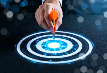 Dart on target board with glowing center. Success and business growth concept. Strategy for achieve goal.