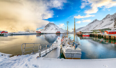 Breathtaking winter sunrise over Ramberg village and harbour.