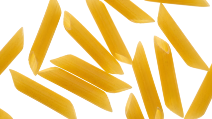 Close up of uncooked penne pasta against a dark black background