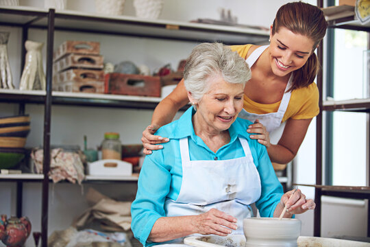 Old woman, learning and teacher with tips, pottery and happy for creative hobby, discussion and help. Instructor, talk and senior person with smile for skills, retirement and lesson for handmade art - Powered by Adobe