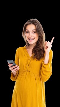 cheerful pregnant woman with a phone smiling and recommending sth isolated over black background