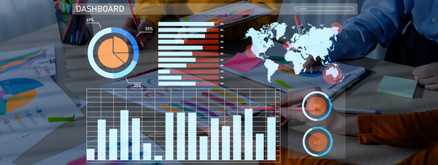 A captivating data dashboard showcasing various analytics graphics, charts, and a world map. A business team collaborates in a modern office setting, emphasizing teamwork. Axiom