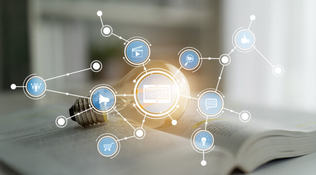 This image captures a light bulb surrounded by digital icons representing innovation and communication, symbolizing the fusion of creativity and technology in education and business. Crux - Powered by Adobe