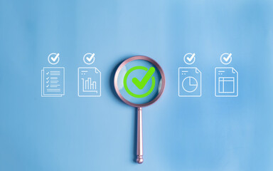 Magnifying glass highlighting success and approval with checkmarks, documents, graphs, and charts on a blue background for business and analysis concepts