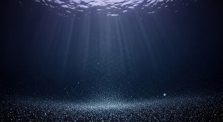 Underwater scene with sunlight beams and tiny bubbles. Represents depth, tranquility and the mysteries of the marine environment, perfect for exploration