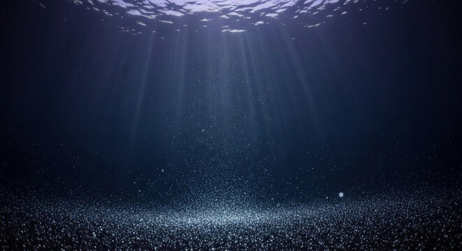 Underwater scene with sunlight beams and tiny bubbles. Represents depth, tranquility and the mysteries of the marine environment, perfect for exploration