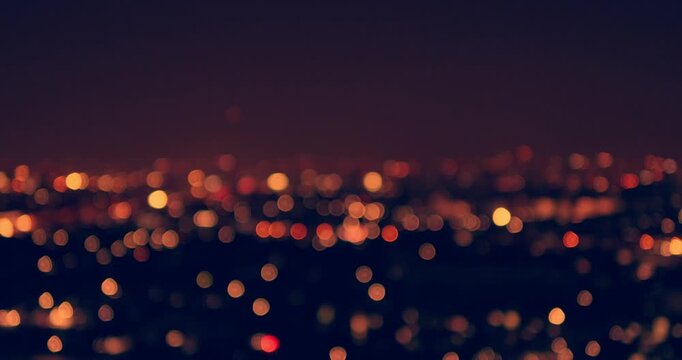 A stunning nocturnal view of city lights capturing serene ambiance of urban life.