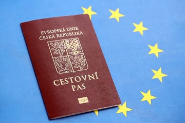 Czech biometrical passport on European Union flag background. Concept of citizenship of Czech Republic