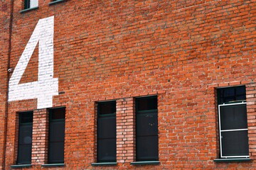 Number nine painted on the wall of a building