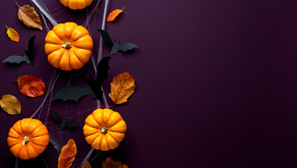 Autumnal Halloween Display: An artful arrangement of pumpkins, leaves, and bats against a backdrop of the season, creating a festive composition.