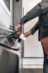 Businessperson Recycling Coffee Cup in a Modern Office Environment
