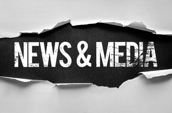 Word NEWS and MEDIA revealed behind torn paper. Conceptual image symbolizing journalism, communication, broadcasting, press freedom, current affairs, and digital information platforms