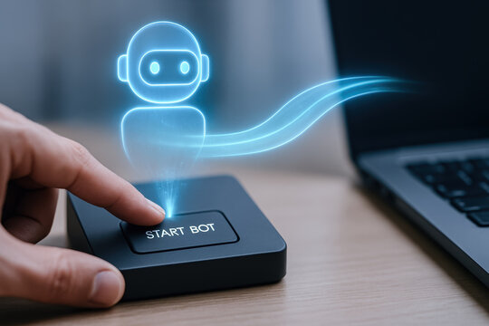 AI robotics automation process RPA transformation business concept with finger pressing start bot button and laptop on desk - Powered by Adobe