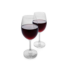Two glasses of red wine are isolated on a white background.