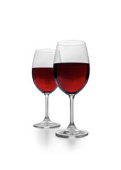 Two glasses of red wine stand against a clean white background.