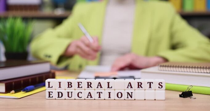 Creative minds flourish in liberal arts education as hands engage with knowledge and ideas at a colorful study space