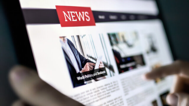 News press release in tablet. Reading newspaper article in tablet. Digital online headlines. Business blog website mockup. Mobile magazine publication in screen.