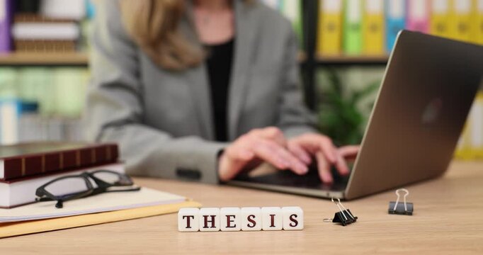 Focused student crafting a thesis with determination at a cozy study space