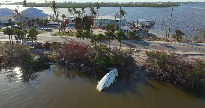Capsized yachts left forsaken on shore after hurricane Milton on Manasota Key in Englewood, Florida.